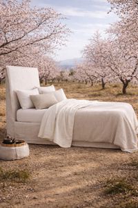 Stonewashed cotton and linen bed linen in a Mediterranean landscape