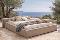 Linen bed in a Mediterranean outdoor setting with natural fabrics and soft neutral tones, by Palma Beds Mallorca.