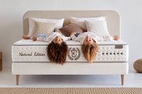 Two children relaxing on the NATUR premium mattress with natural cotton, wool and latex, available at PALMA BEDS in Mallorca. Two children relaxing on the NATUR premium mattress with natural cotton, wool and latex, available at PALMA BEDS in Mallorca.