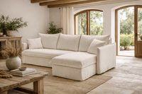 GRACE sofa bed with chaise lounge in a bright Mediterranean-style living room.